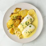 Merluza al limón con patatas panaderas y cebolla - Imagen 2